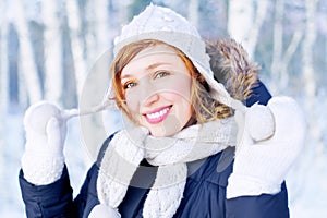 Beautiful girl in winter forest