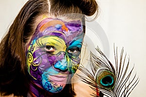 Beautiful girl, woman, body art, drawn drawing on the face close-up