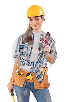 Beautiful girl in work wear holding tools isolated on white