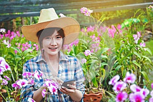 Beautiful girl working flower farm Hold the phone