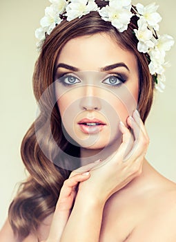 Beautiful girl with a wreath of flowers on her head.