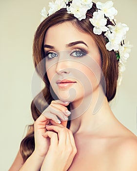 Beautiful girl with a wreath of flowers on her head.