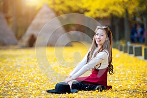 Beautiful Girl with Yellow Leaves in Nami Island.