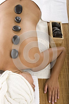 Beautiful girl with zen stones