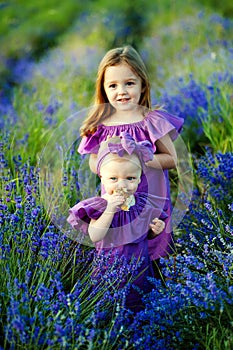 Beautiful girlfriend resting on the nature. Two cute sisters posing in the park