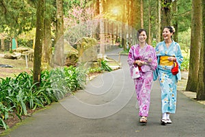 Girlfriends traveler women wearing japanese kimono