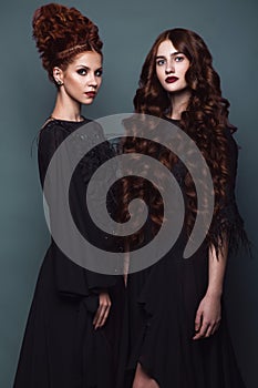 Beautiful girls in evening dress with avant-garde hairstyles. Beauty the face.