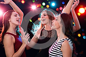 Beautiful girls have fun at a Christmas party