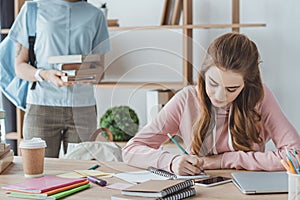 beautiful girls studying together