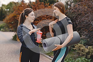 Sports girls training in a summer forest