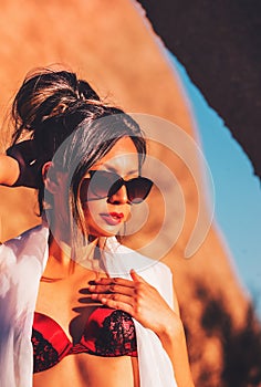 Beautiful glamor model posing in desert