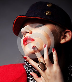 Beautiful glamorous young woman in stylish cap