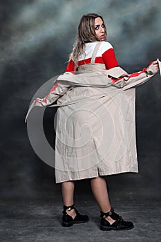 Beautiful, glamourous blonde girl posing in studio on isolated background. Style, trends, fashion concept.