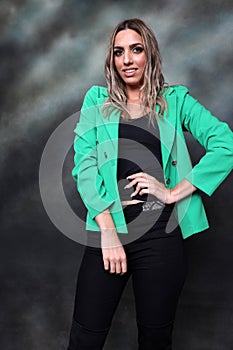 Beautiful, glamourous blonde girl posing in studio on isolated background. Style, trends, fashion concept.