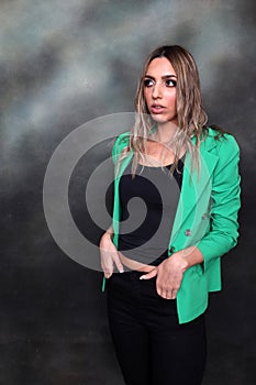 Beautiful, glamourous blonde girl posing in studio on isolated background. Style, trends, fashion concept.