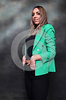 Beautiful, glamourous blonde girl posing in studio on isolated background. Style, trends, fashion concept.