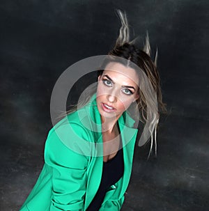 Beautiful, glamourous blonde girl posing in studio on isolated background. Style, trends, fashion concept.