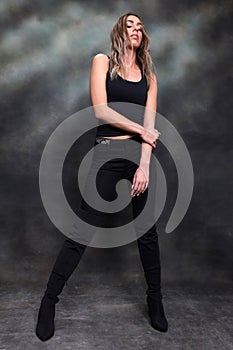 Beautiful, glamourous blonde girl posing in studio on isolated background. Style, trends, fashion concept.