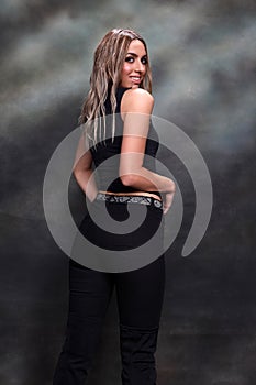 Beautiful, glamourous blonde girl posing in studio on isolated background. Style, trends, fashion concept.