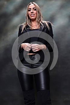 Beautiful, glamourous blonde girl posing in studio on isolated background. Style, trends, fashion concept.