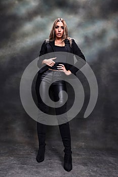 Beautiful, glamourous blonde girl posing in studio on isolated background. Style, trends, fashion concept.