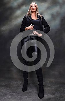 Beautiful, glamourous blonde girl posing in studio on isolated background. Style, trends, fashion concept.