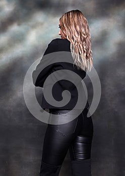 Beautiful, glamourous blonde girl posing in studio on isolated background. Style, trends, fashion concept.