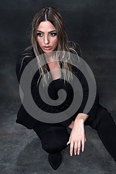Beautiful, glamourous blonde girl posing in studio on isolated background. Style, trends, fashion concept.
