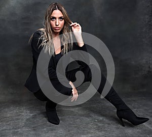 Beautiful, glamourous blonde girl posing in studio on isolated background. Style, trends, fashion concept.