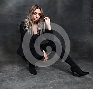 Beautiful, glamourous blonde girl posing in studio on isolated background. Style, trends, fashion concept.