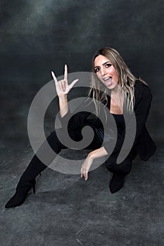 Beautiful, glamourous blonde girl posing in studio on isolated background. Style, trends, fashion concept.