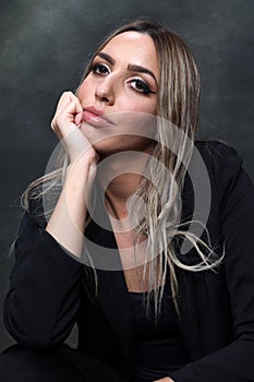 Beautiful, glamourous blonde girl posing in studio on isolated background. Style, trends, fashion concept.