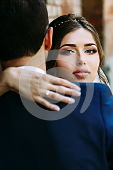 Beautiful glance of the young happy bride photo