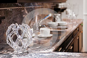 Beautiful glass vase on the marble worktop