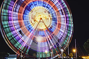 Beautiful glowing Ferris wheel against dark sky