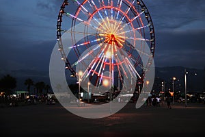 Beautiful glowing Ferris wheel in amusement park