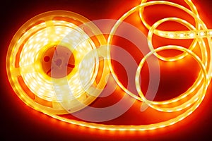 Beautiful glowing LED strip of red light for mounting decorative lighting for homes, offices and other dark places