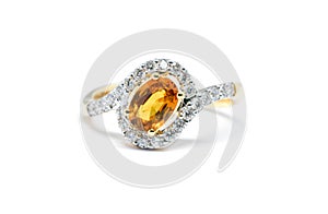 Beautiful Gold ring with diamond and yellow sapphire isolated