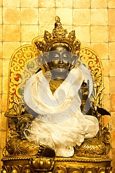 Beautiful gold statue of Buddha in the Buddhist monastery, Tibet.