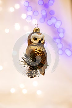 Beautiful gold tree toy in the form of an owl