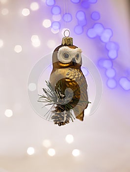 Beautiful gold tree toy in the form of an owl