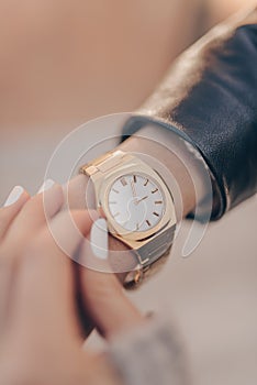 Beautiful gold watch on woman hand