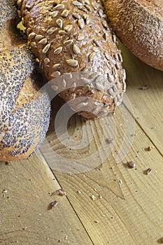 Beautiful Golden bread with seeds on the kitchen table