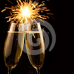 Beautiful golden champagne with sparklers - black square