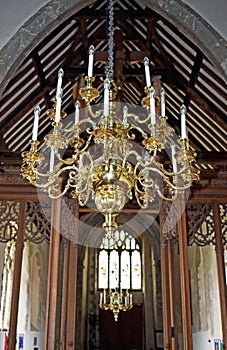 Beautiful golden coloured chandelier in a Christian Church where people come to pray