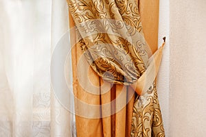 Beautiful golden curtain in the bedroom