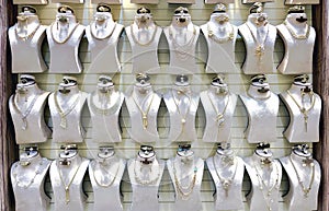 Beautiful golden jewelry on mannequins at the gold street Deira market