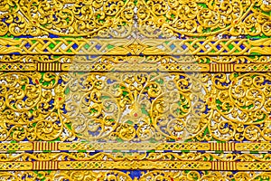 Beautiful golden patterned background on the Buddhist church gable end. Close up golden pattern background crafted on the gable in