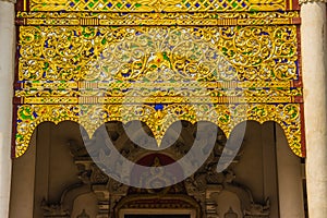 Beautiful golden patterned background on the Buddhist church gable end. Close up golden pattern background crafted on the gable in