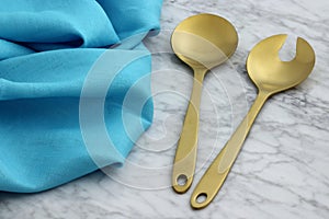 Beautiful golden serving spoon and fork